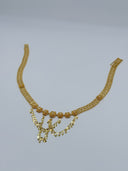 Full view of the gold-tone sunburst flower coin drop mesh waist belt showing the wide diamond-link mesh chain body, flower medallion row, and cascading V-drape coin disc drops