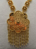 Close-up of the Zahra cluster pendant showing overlapping open-lace filigree flower circles with granulated beaded borders and cascading floral tassel fringe