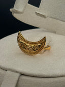 Detail of the Hilal wide crescent-face ring showing the granulated beaded border and engraved floral scrollwork on the face, displayed in a cream ring box