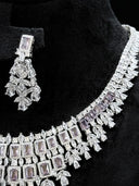 Detail of one chandelier earring and the upper necklace chain showing the lavender rectangular halo top stone and marquise leaf cluster body