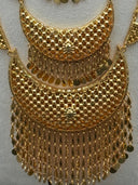 Two strands of the long half-moon link necklace draped on a white velvet bust showing lattice half-moon links and daisy-wheel spacers