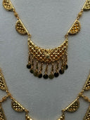 Triple-tier half-moon drop earrings on a white velvet earring stand showing three stacked lattice half-moon links in descending size