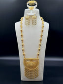 Full 5-piece Gulf-style jewelry set on a white velvet bust — long bicone bead necklace with large filigree hilal pendant, crescent drop earrings, bracelet, and ring