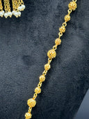Close-up of the textured round ball-bead chain of the necklace