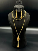 Full view of the rope-texture ball bead lariat necklace and drop earring set on a black bust, showing the long chain and diamond-shaped cluster pendant
